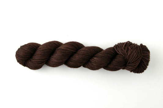 Dark brown skein of tonal yarn.