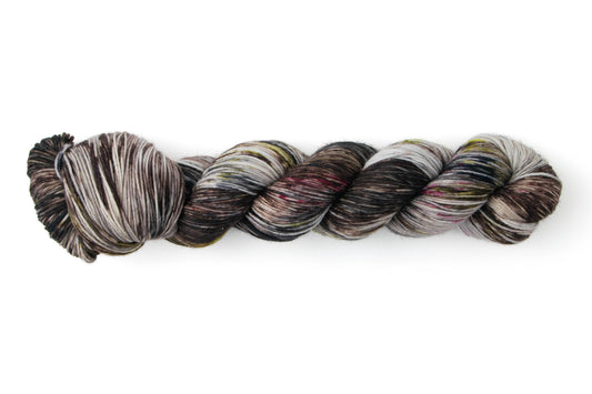 A skein of yarn with lots of moody colors.