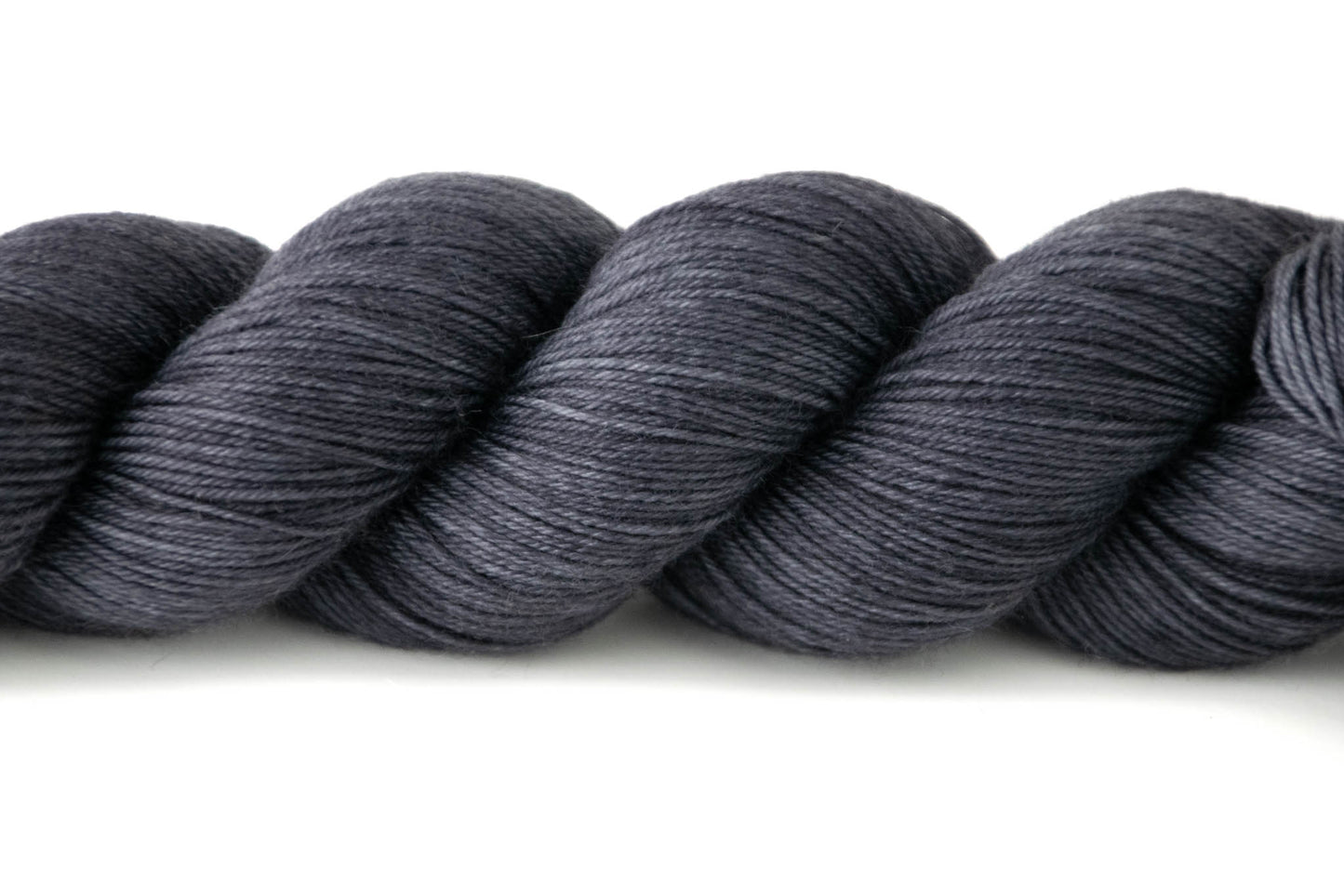 Closeup on the slight variations in tone of Pueblo from dark gray to black.