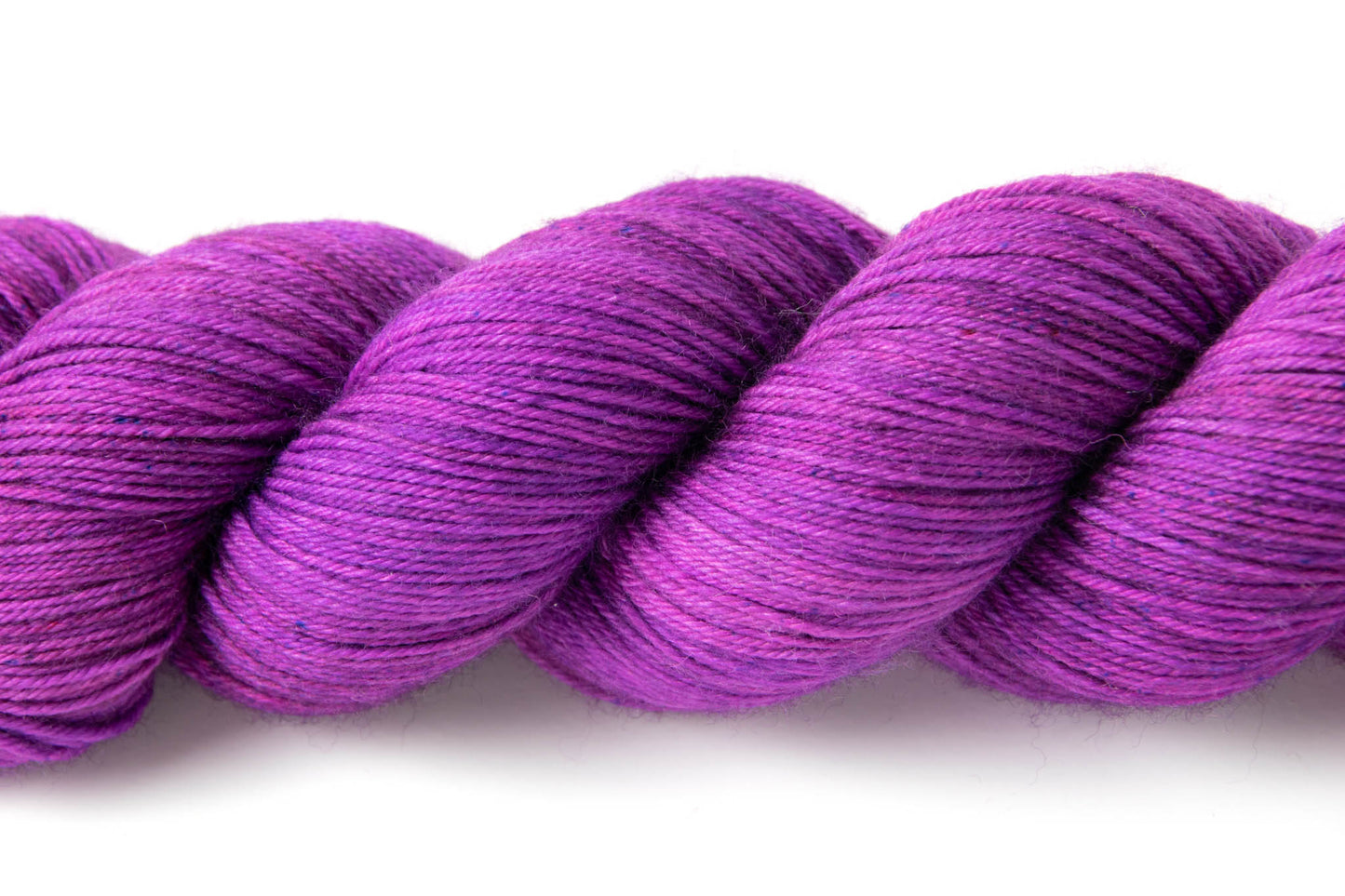 Closeup on the tiny blue and dark purple speckles.