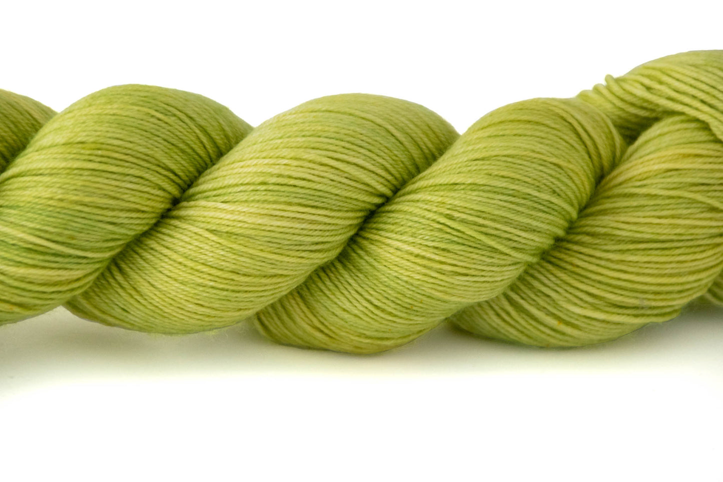 Closeup on the faint variation in color between lemon yellow and lime green.