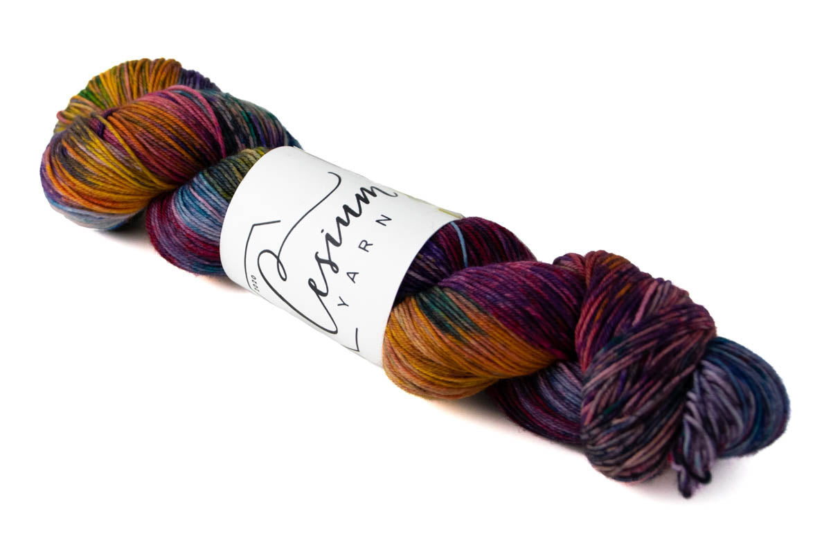 A deep-toned multicolored skein of hand-dyed yarn.