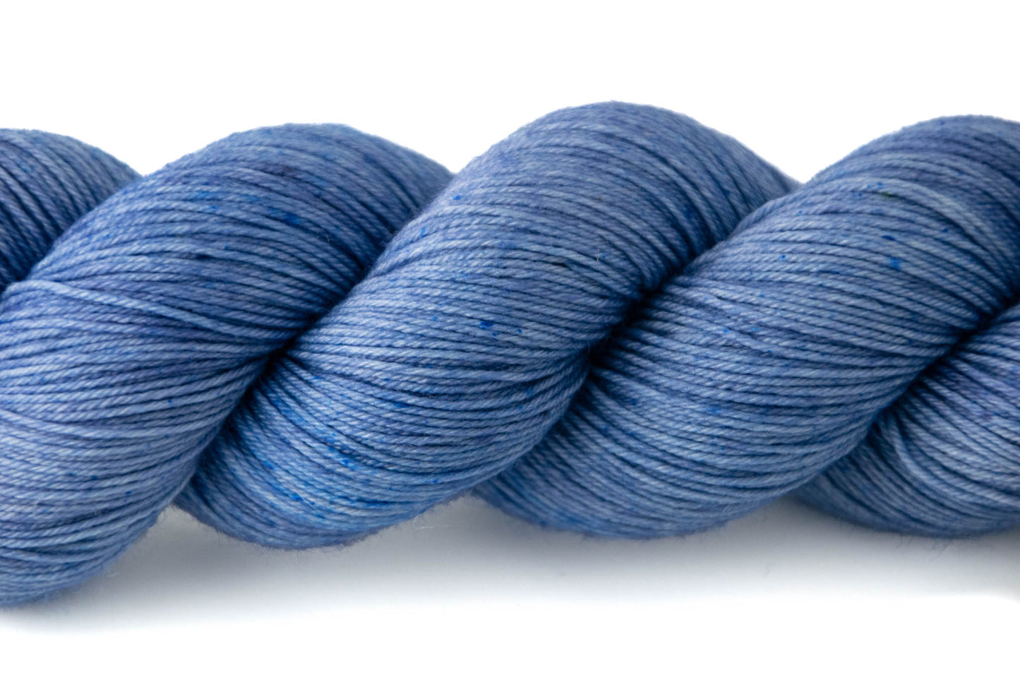 Close view of the tonal nature of Look for the Helpers, with microspeckles of indigo blue.