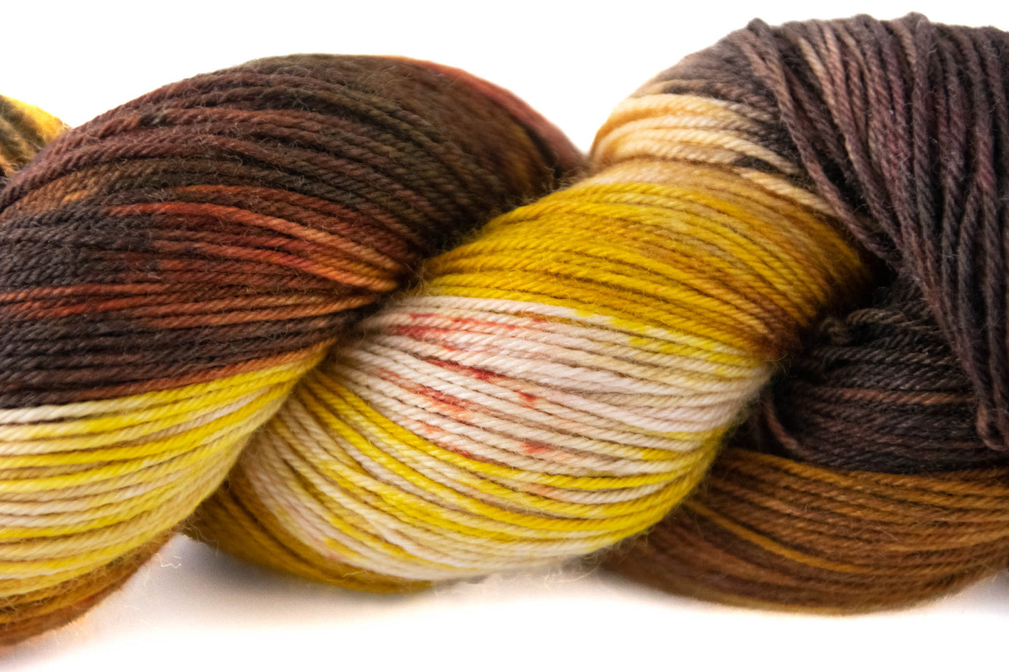 A closeup of the yellow and white sections with burnt orange speckles.