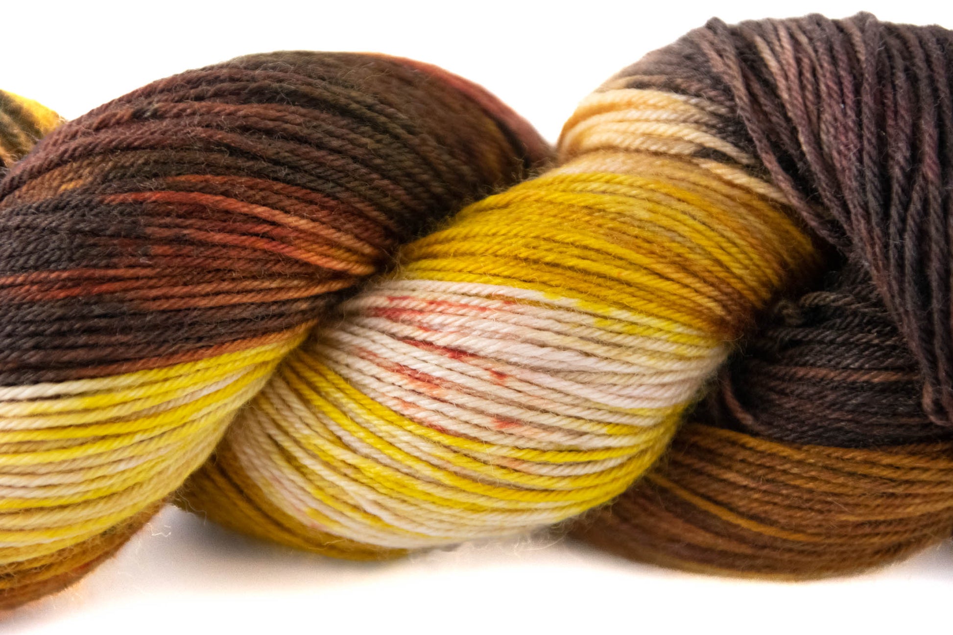 A closeup of the yellow and white sections with burnt orange speckles.