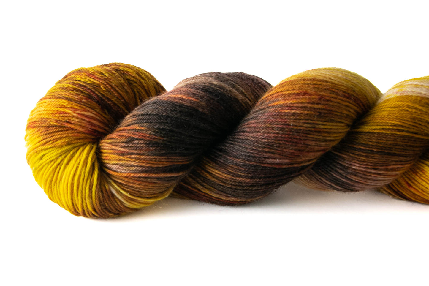 Closeup of the variegated brown and yellow texture with umber accents.