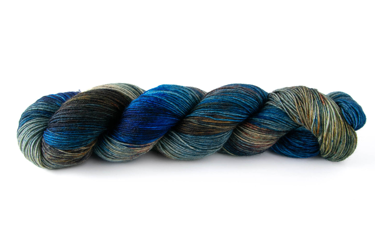 A skein of deep blue hand-dyed wool yarn with sections of dark brown and lighter tan sections with orange speckles.