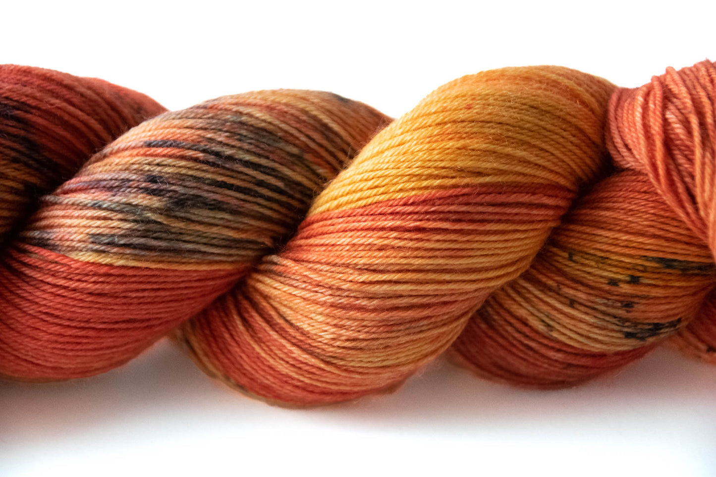 Closeup on the red-to-yellow variegation and black speckles.
