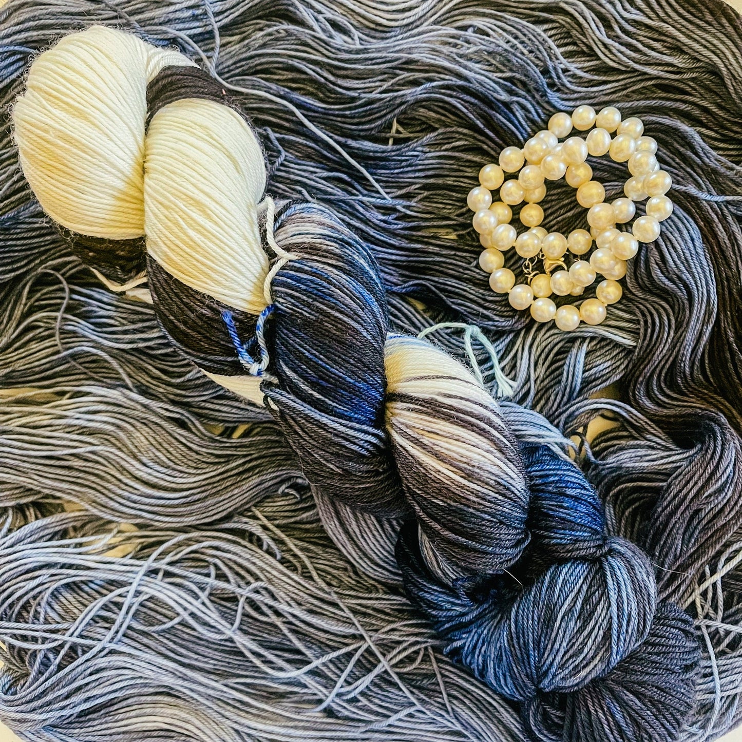 Hey Ewe Guys with its companion variegated hand-dyed yarn, Follow Them Size Fives.