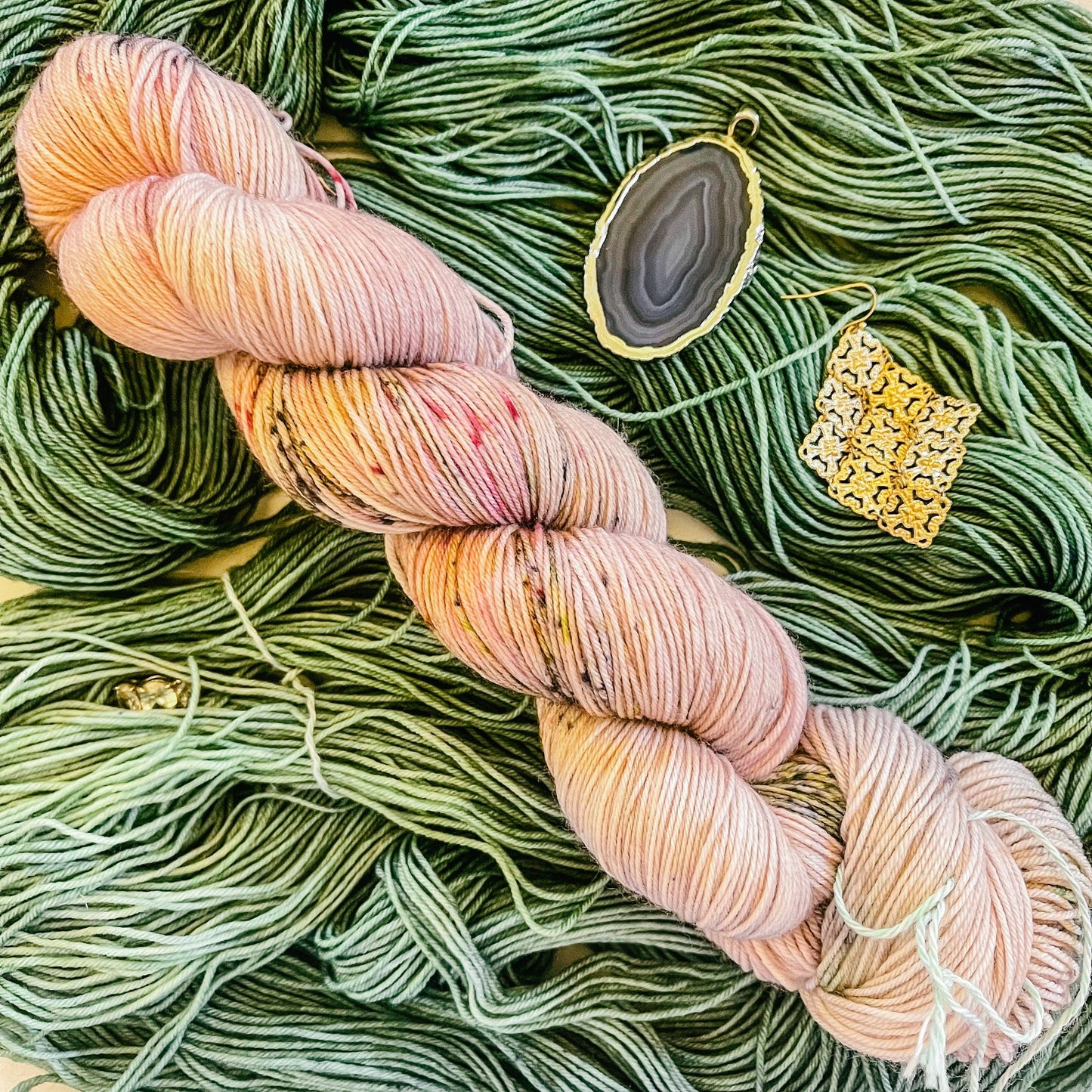 One-Eyed Woolie with its companion pink and brown speckled colorway, Truffle Shuffle.