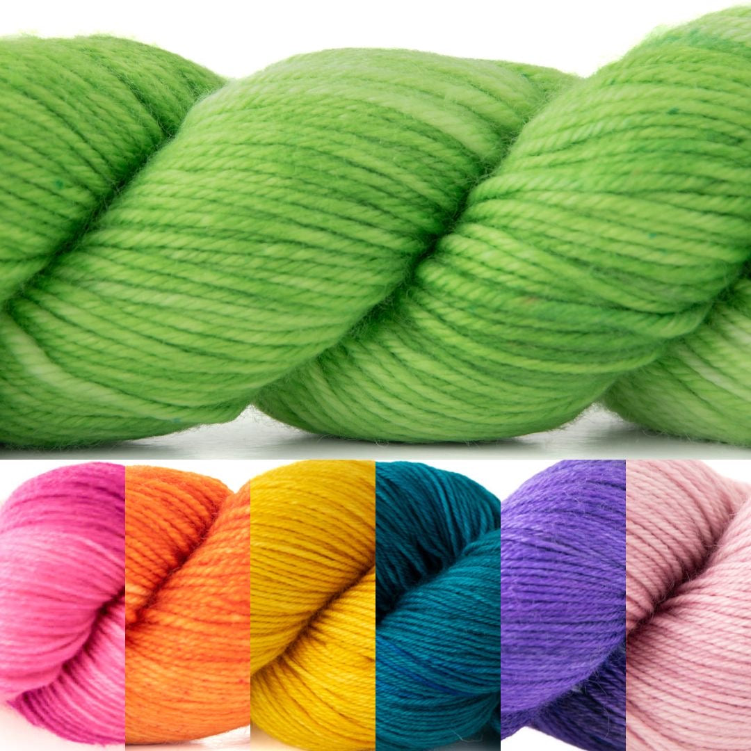 A photo of one large bright green skein of yarn and sections of six skeins in: bright pink, orange, yellow, teal, purple, and light pink.