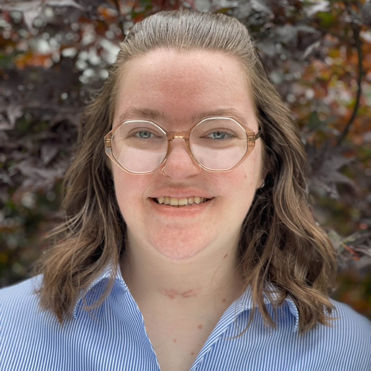 Cat, a white woman with brown hair and glasses