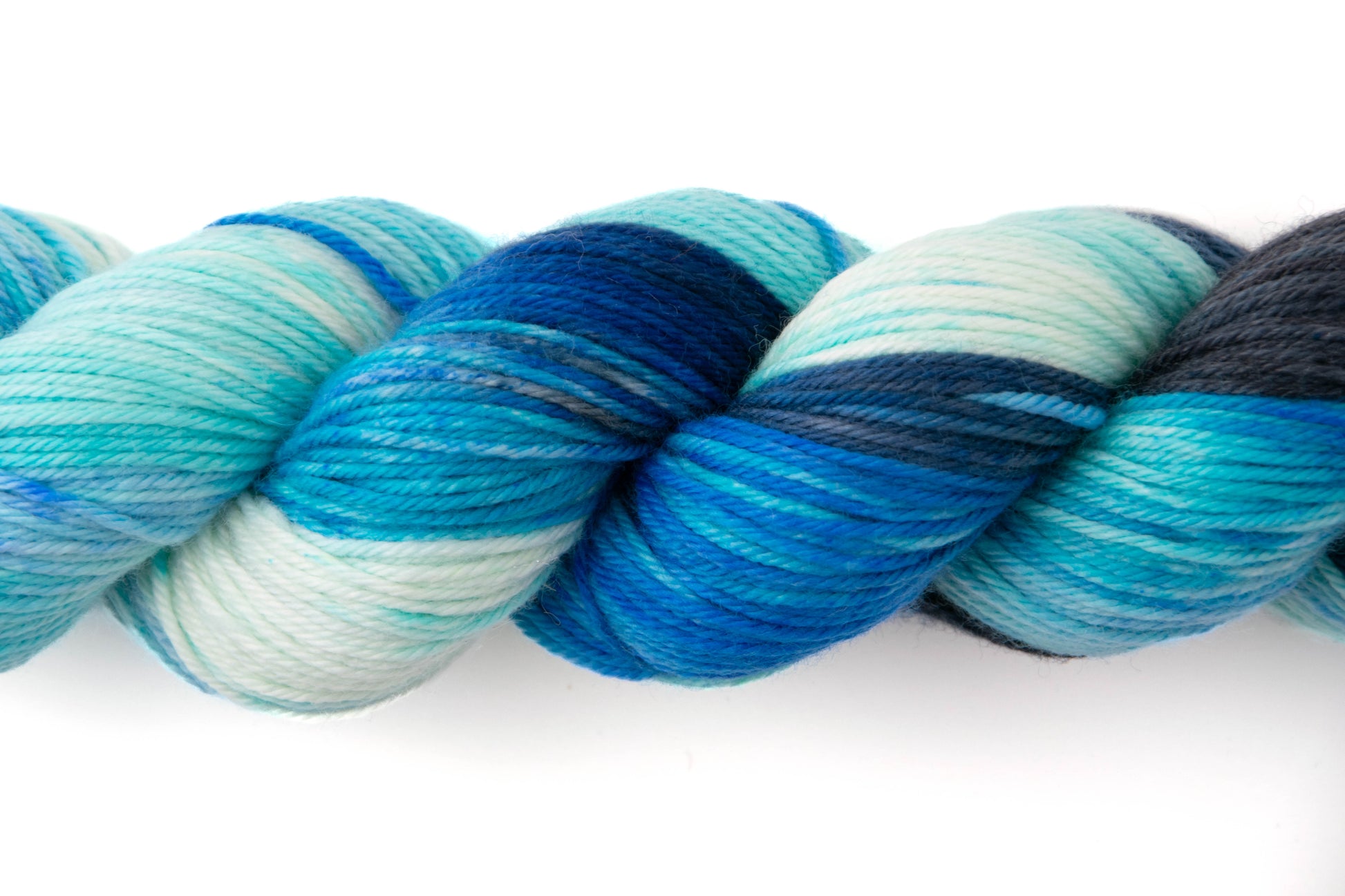 Close view of yarn with variegated blues.