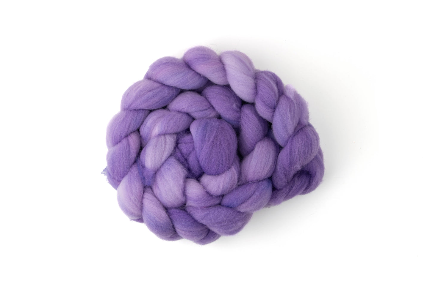 A skein of superwash purple fiber.