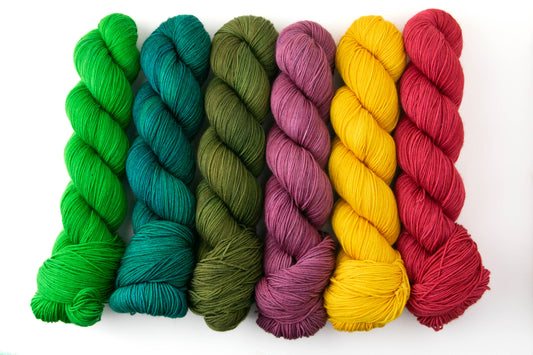 The tonals in the Dragon Tales collection, including bright green, teal, olive green, magenta, yellow, and red.