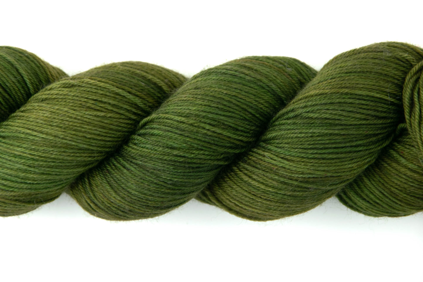 Close view of the variation in tones from lighter olive to a nearly brown green.