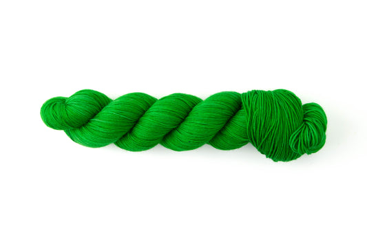 An almost neon green skein of yarn.