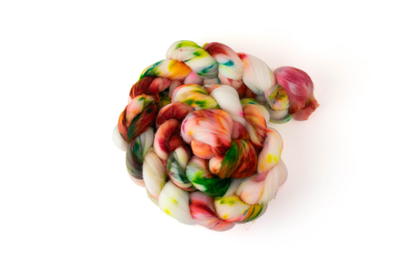 A braid of fiber with sections of dark red and green and neon yellow, orange, and pink on a white background.