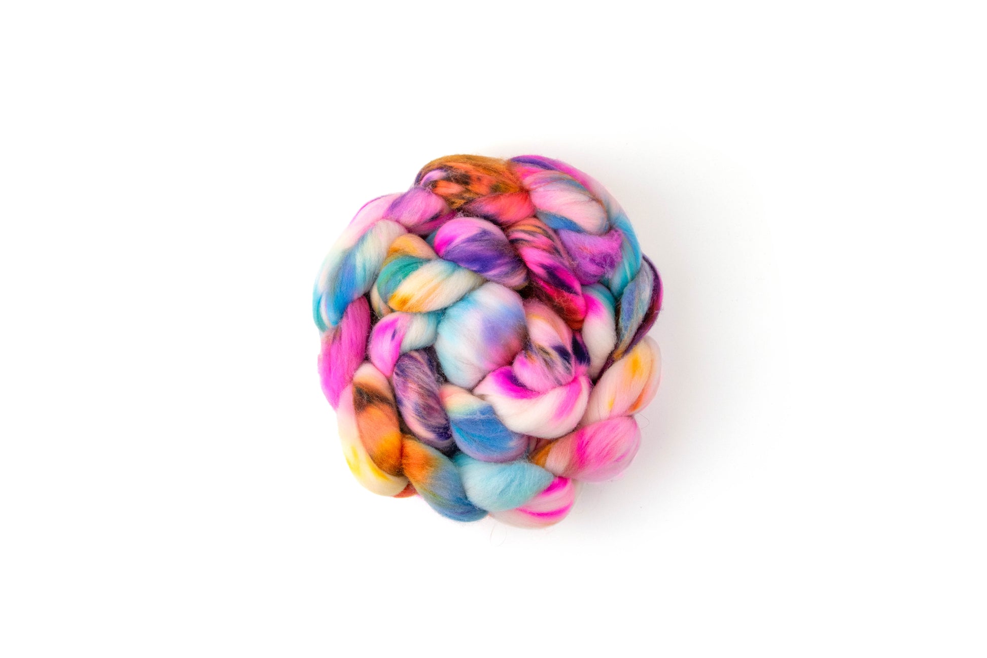 A braid of bright fiber wrapped into a circle of pink, orange, blue, and purple with a white base.