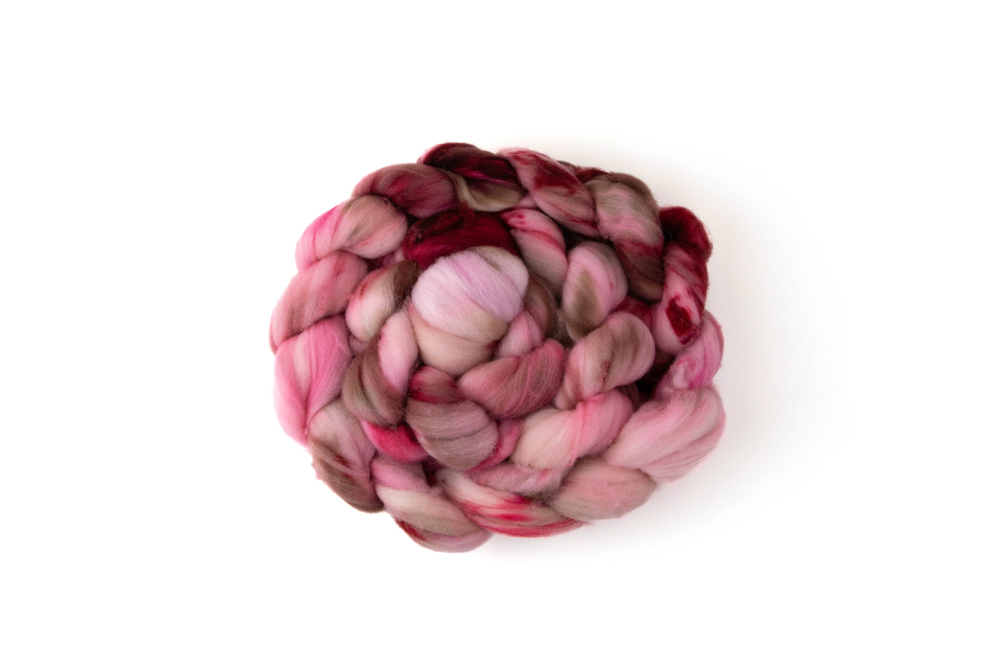 A braid of fiber in pink, red, and brown colors.