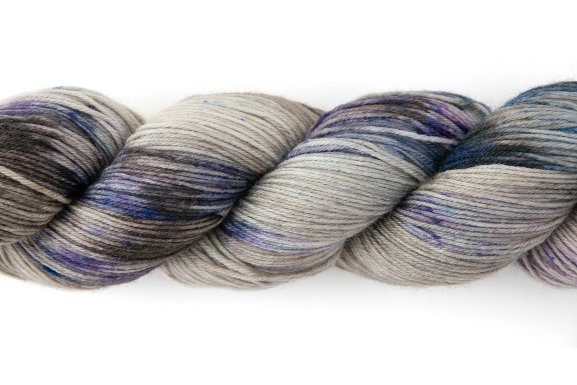 Closeup on purple and blue swathes with tiny microspeckles of the same colors.