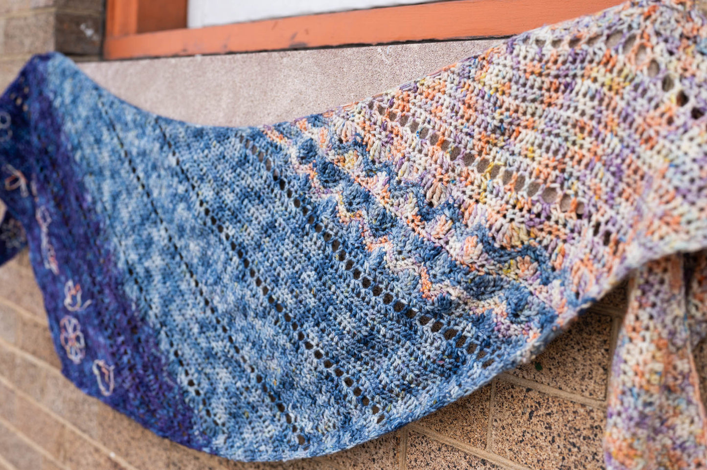 A side view emphasizing the texture of the Replenishment crochet shawl.