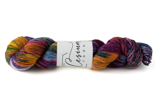 A deep-toned multicolored skein of hand-dyed yarn.