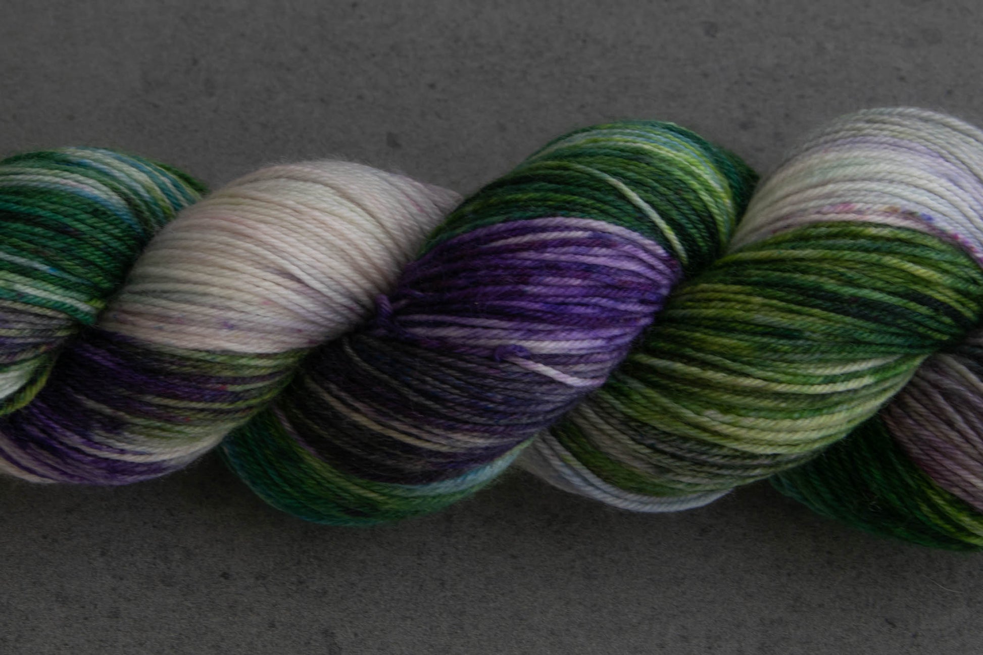 Closeup on the variegations, including sections of purple, green, and white.
