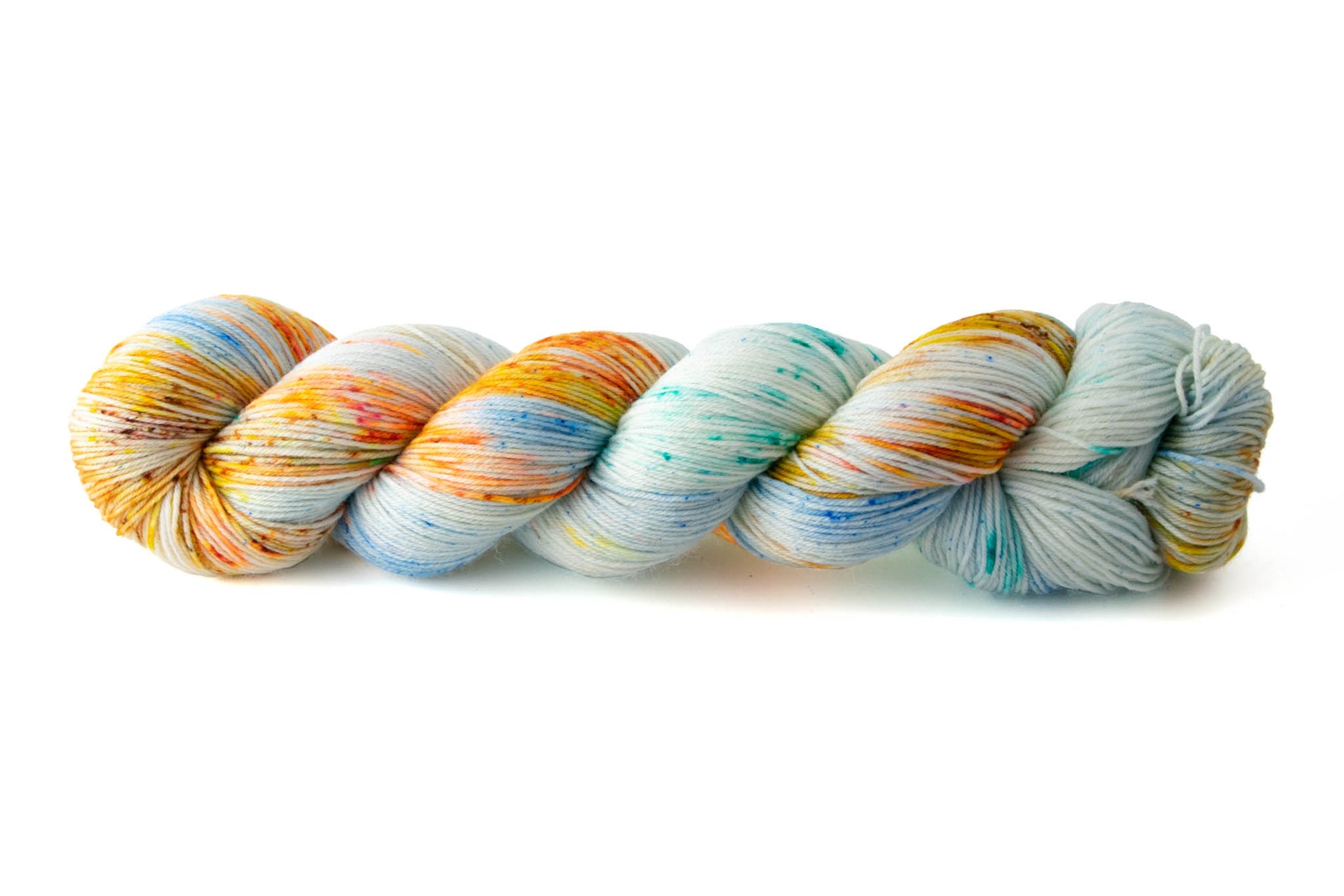 A speckled skein with sections of orange and yellow, aqua and blue, and tiny bits of red-brown on a white background.