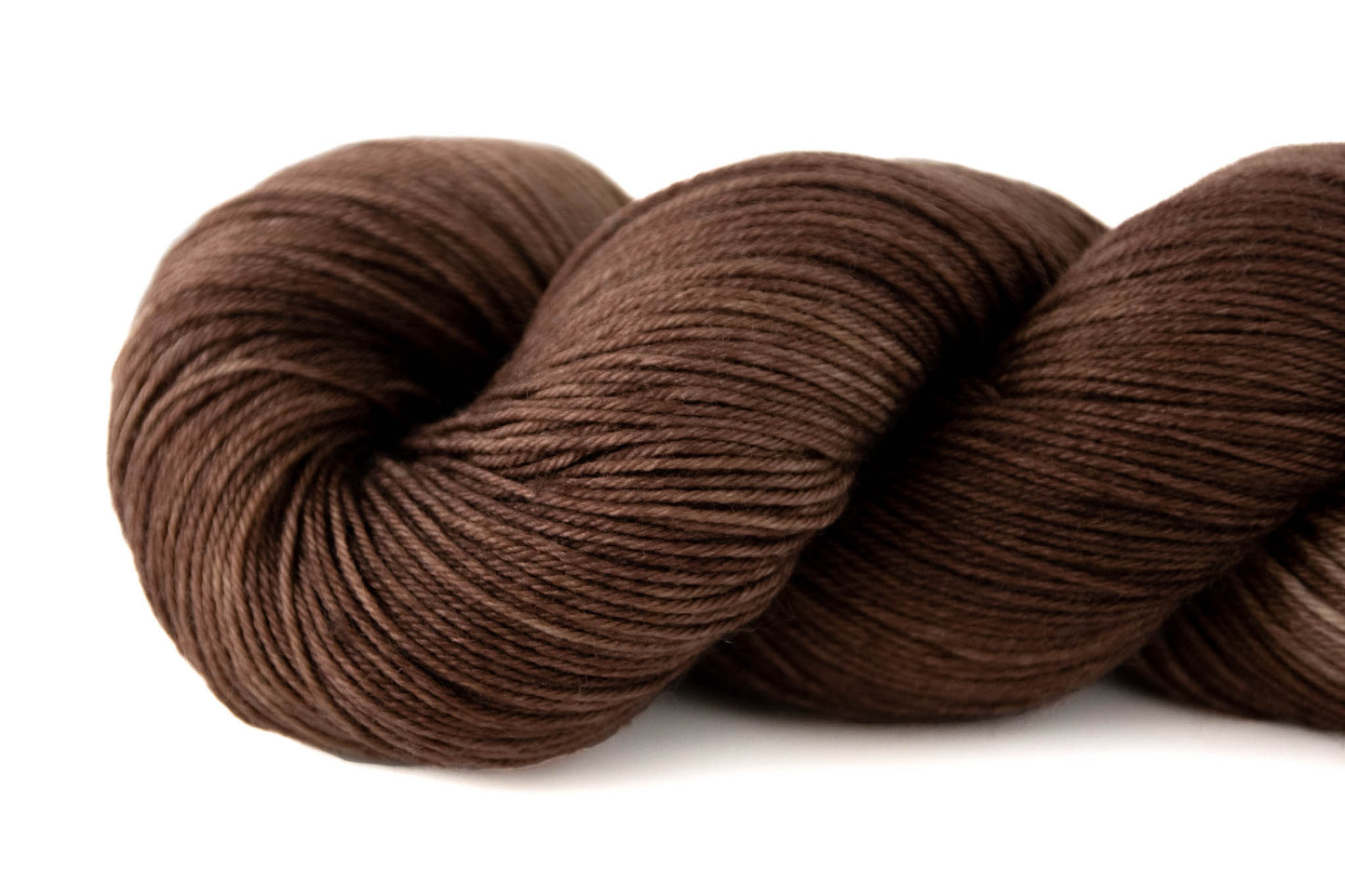 View of lighter and darker brown strands in the same skein.